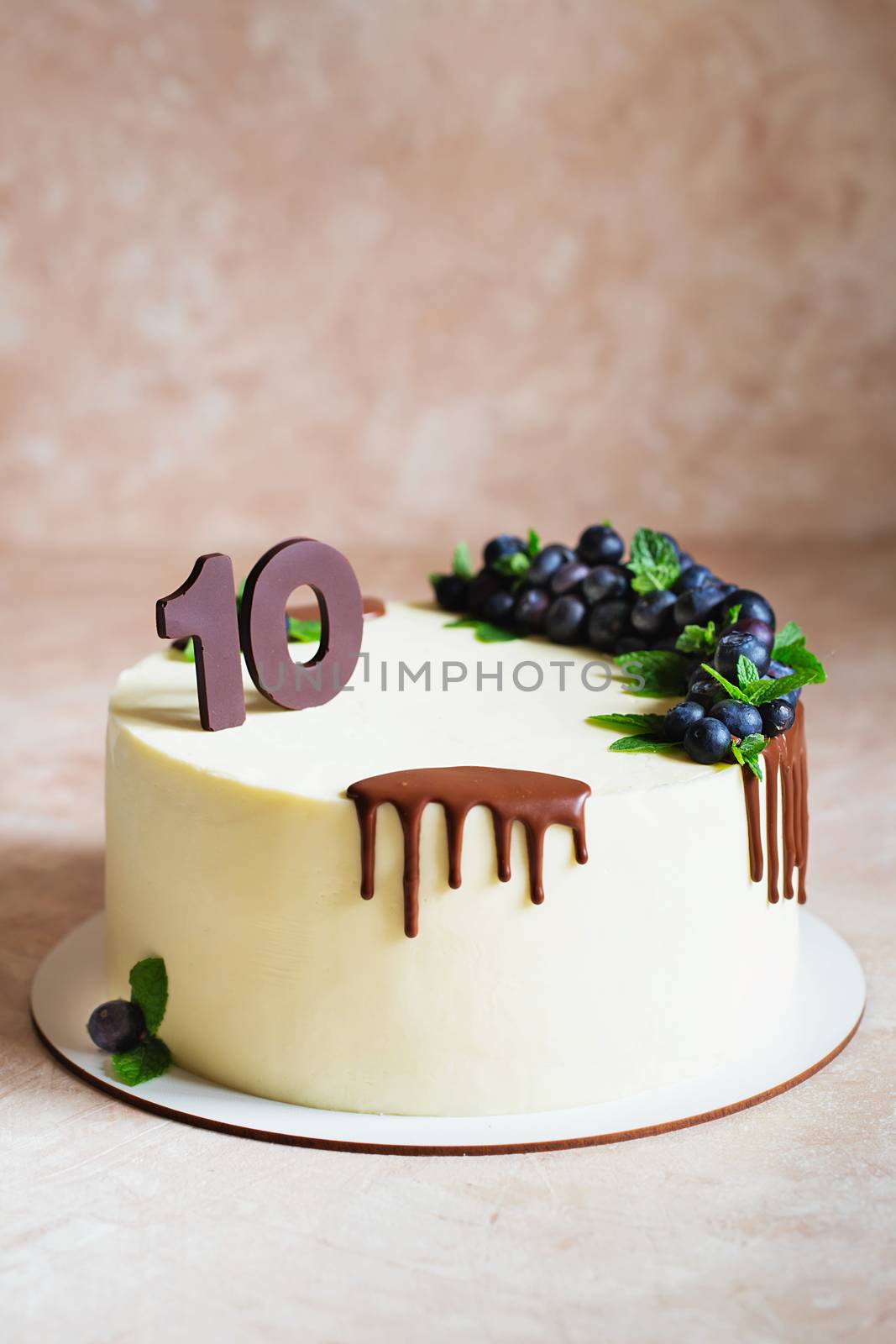 Birthday cake for a ten year old child. White cake with chocolat by natazhekova