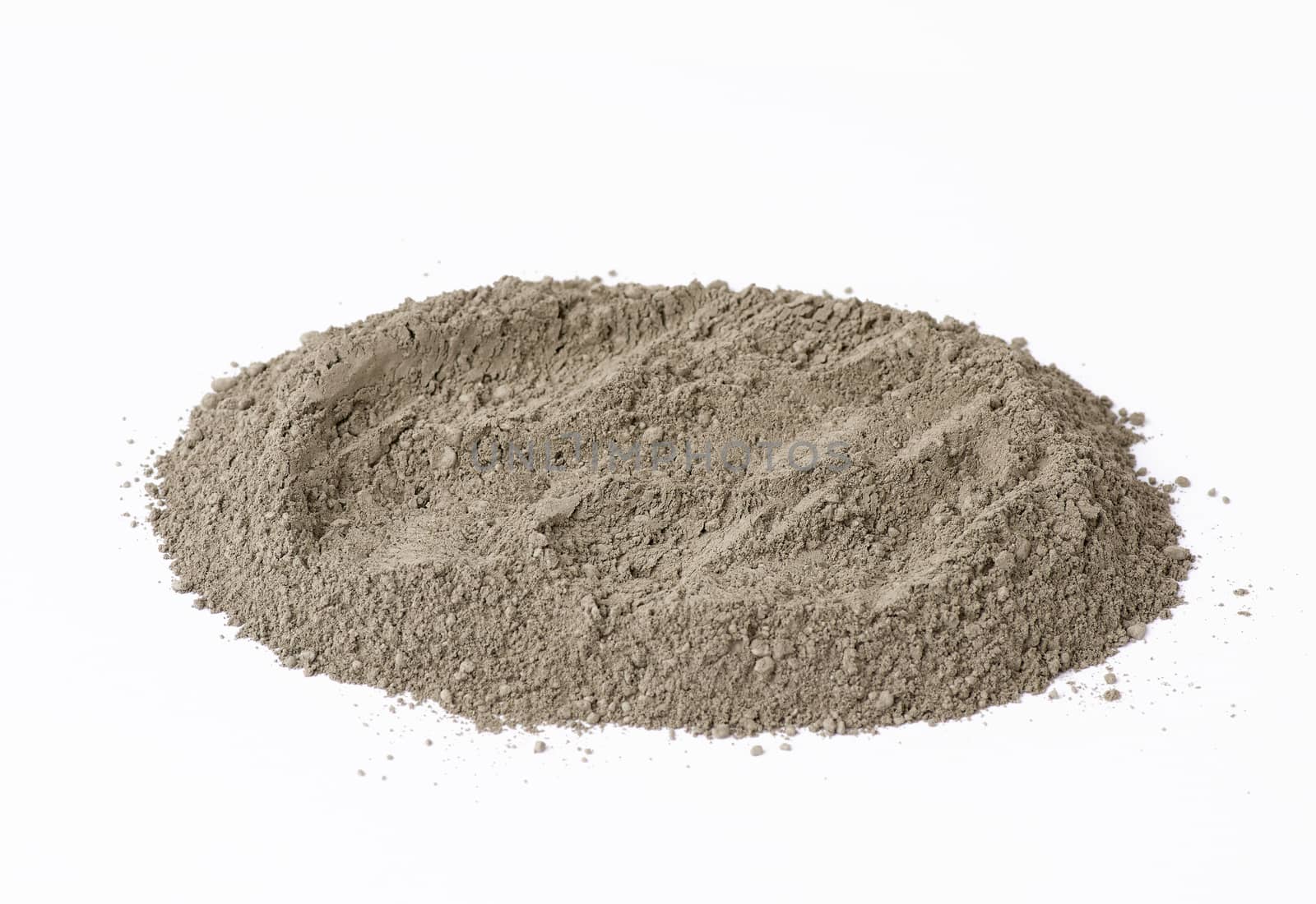 pile of gray dry Crimean fine clay on a white background, treatment for face and body
