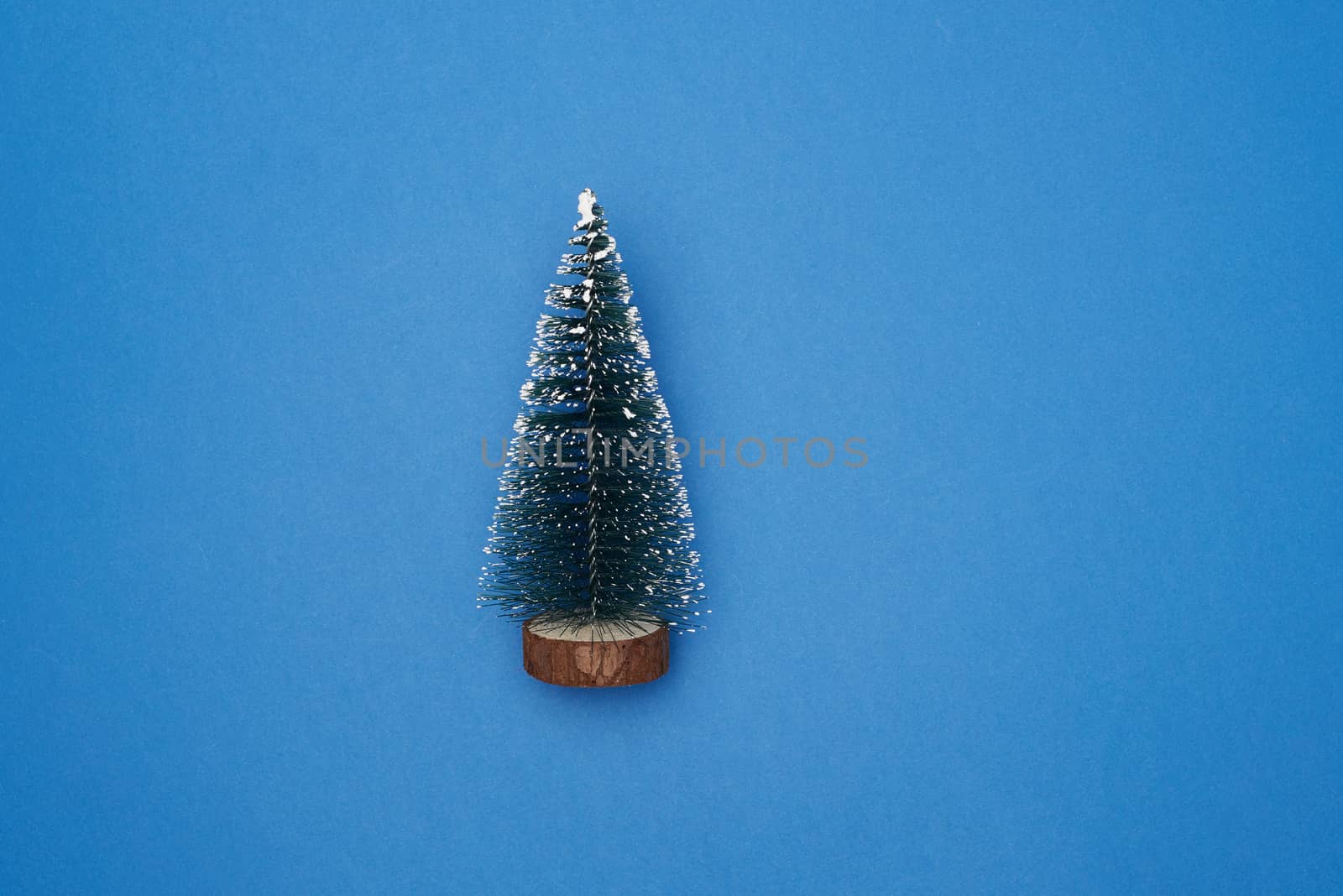 Christmas decor New Year tree on a blue background, top view