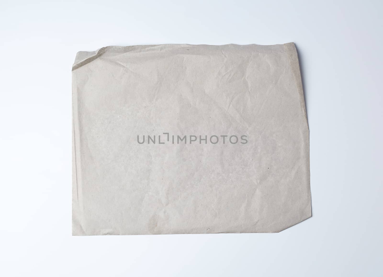 empty gray crumpled sheet of paper, full frame, close up