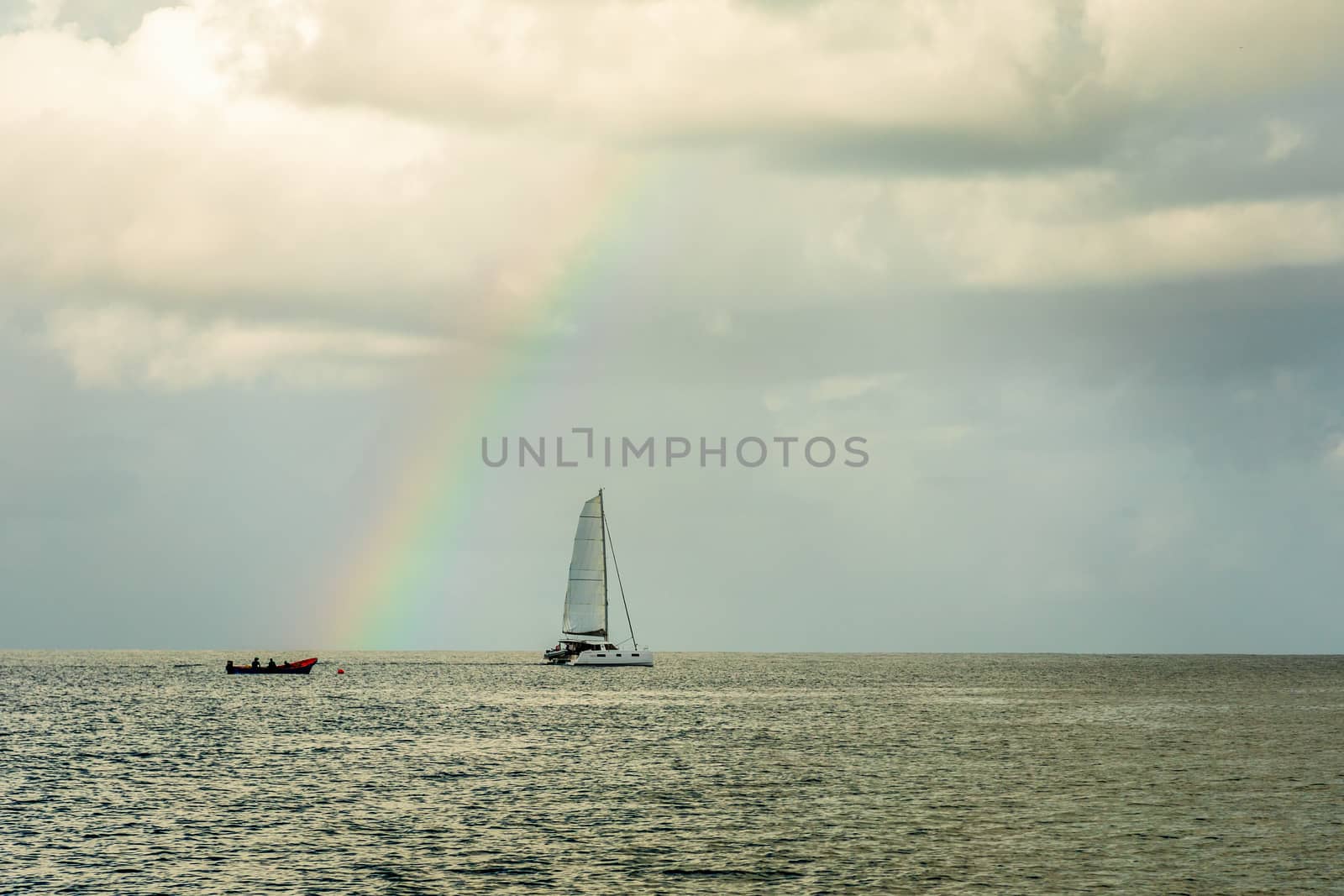 Catamaran at Rodney bay with rainbow in the backround, Saint Lucia, Caribbean sea