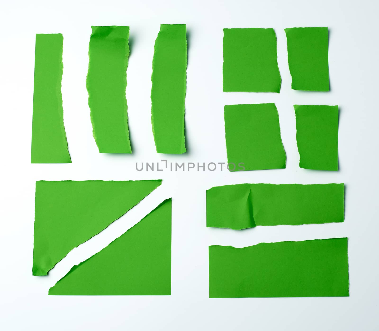 various blank pieces of green paper on white background, copy space