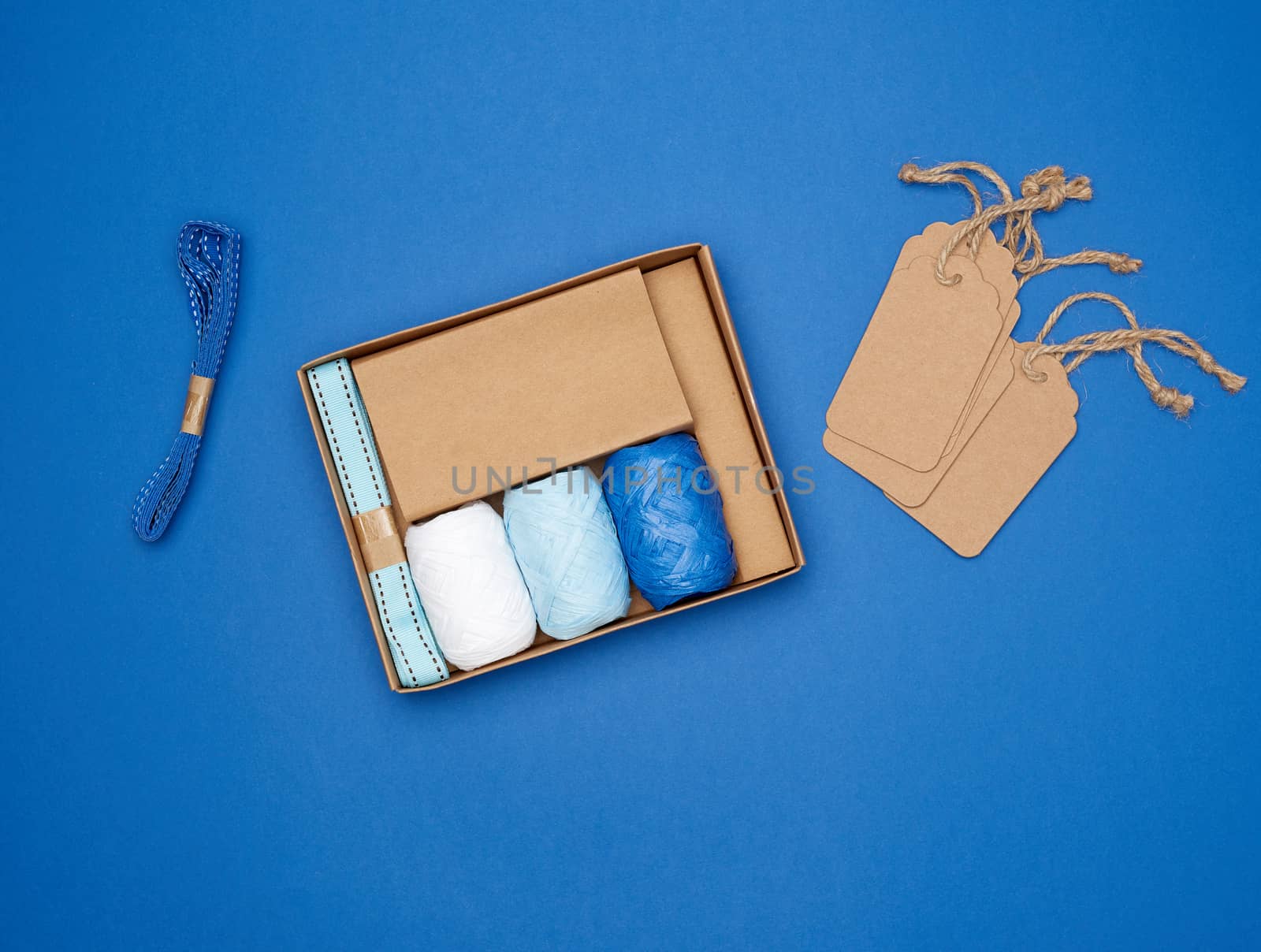 set for packing holiday gifts on a blue background, top view
