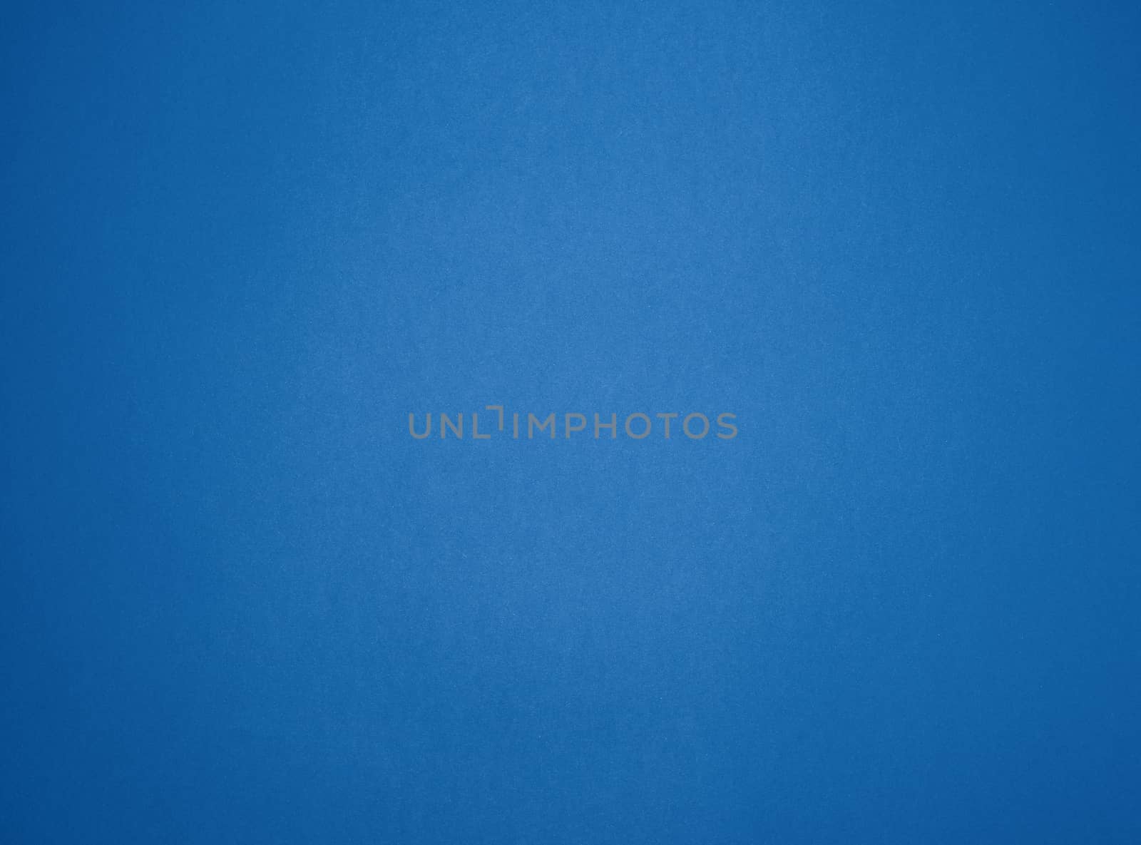 empty blue paper background with vignette, place for an inscription, trendy classic color