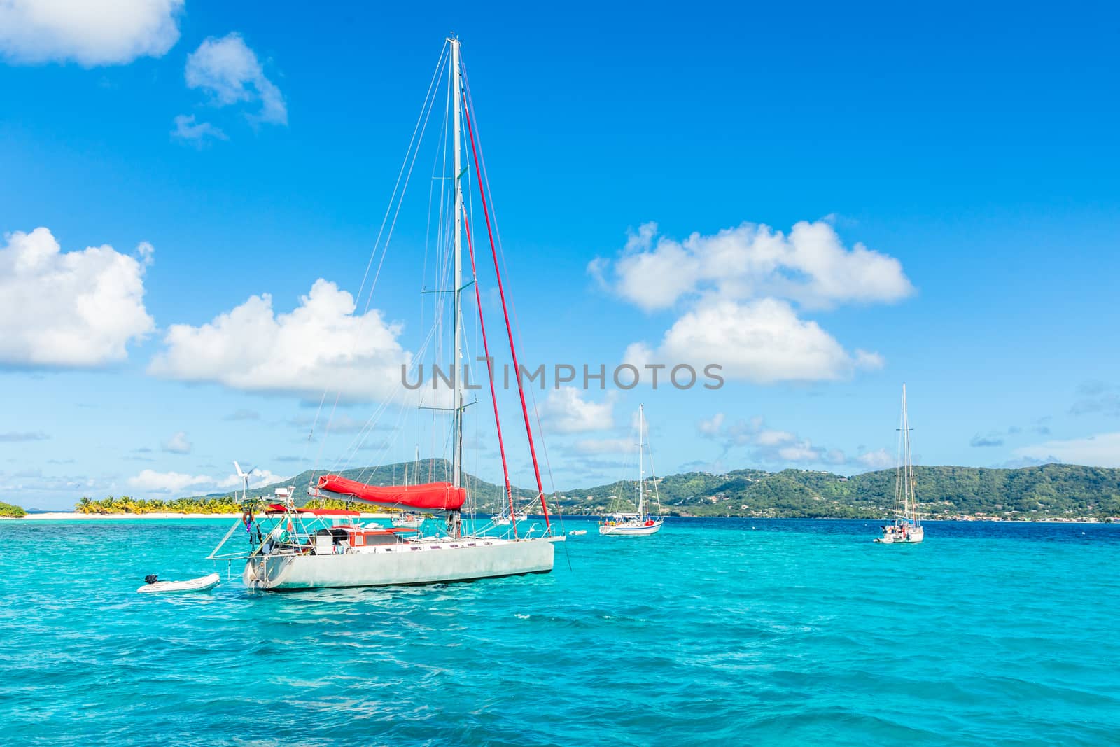 Turquoise sea and anchored yachts near Carriacou island, Grenada by ambeon