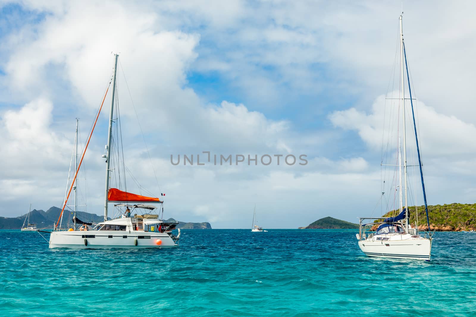 Turquoise sea and anchored yachts and catamarans, Tobago Cays, Saint Vincent and the Grenadines, Caribbean sea