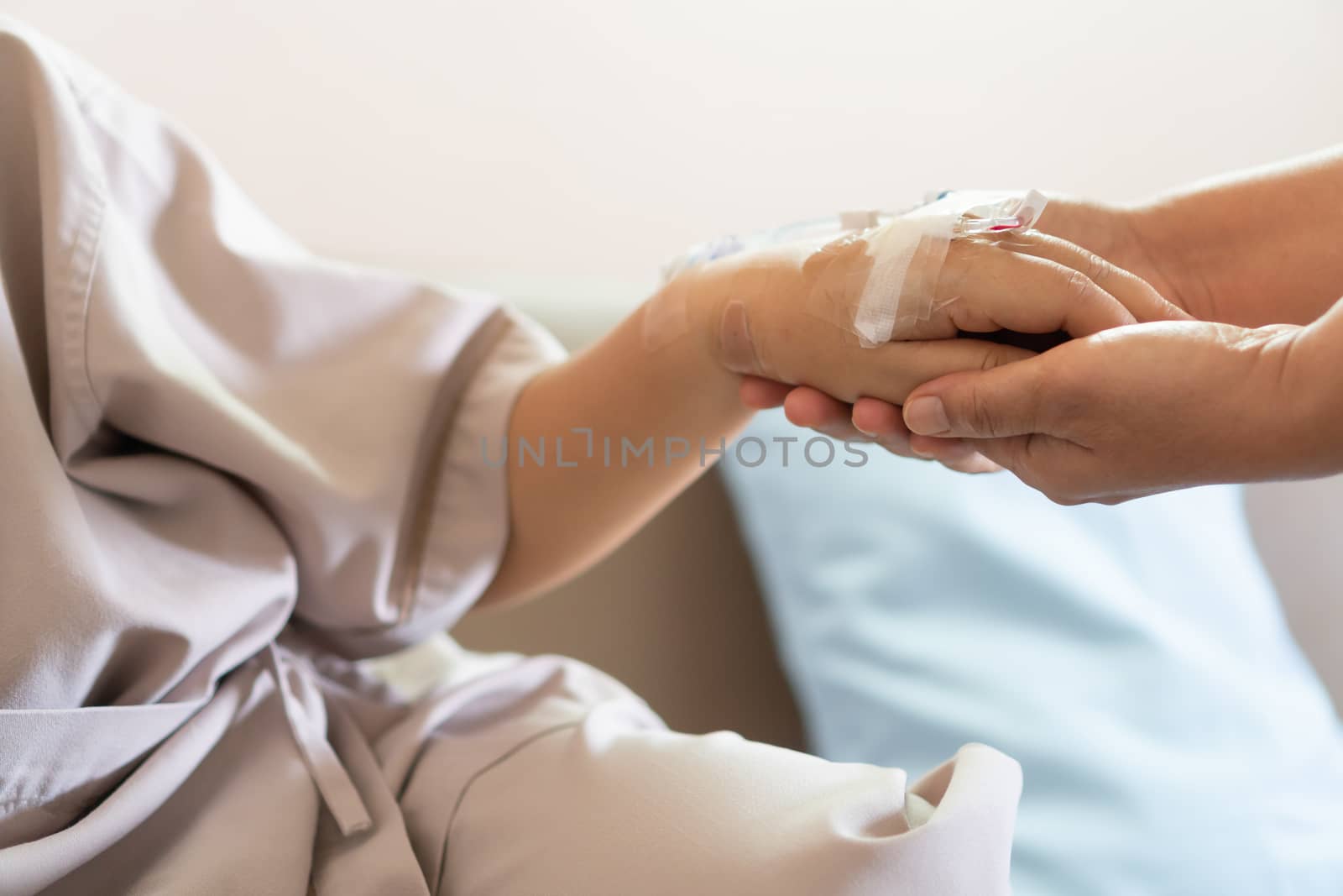 Love hope concept: Daughter Visits mother holding hand for recov by smolaw11