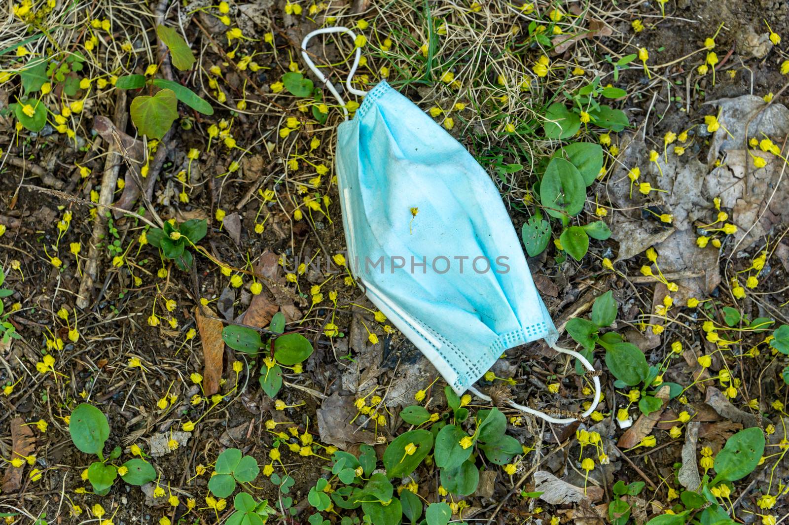 Discarded face mask dumped on the ground during the Covid-19 pandemic