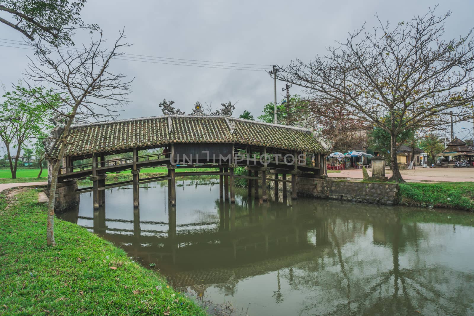Old river bridge in Vietnamese village. Hue, Vietnam - March 9, 2020.