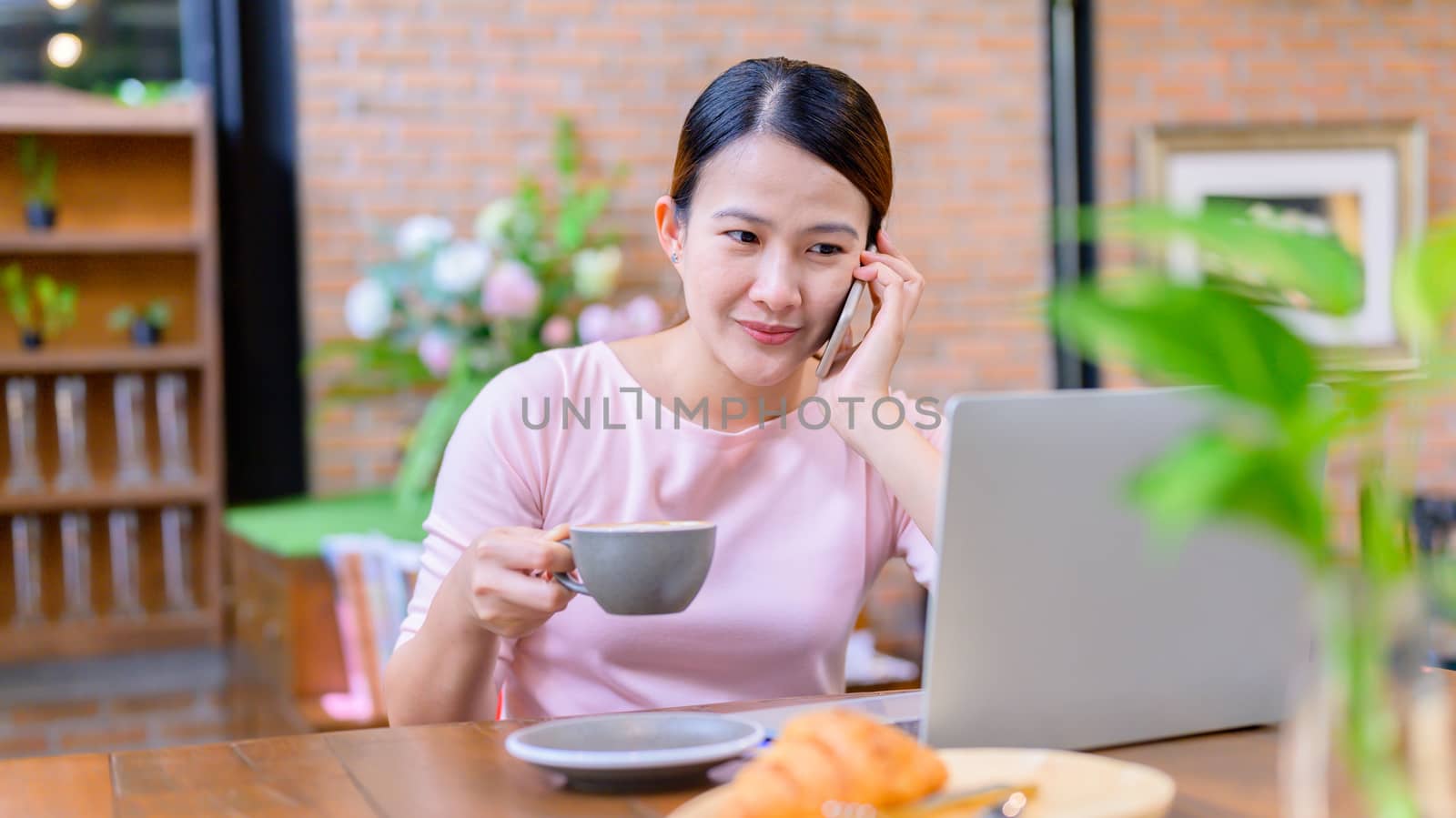 Asian businesswoman working online. New normal and life after CO by graphixchon