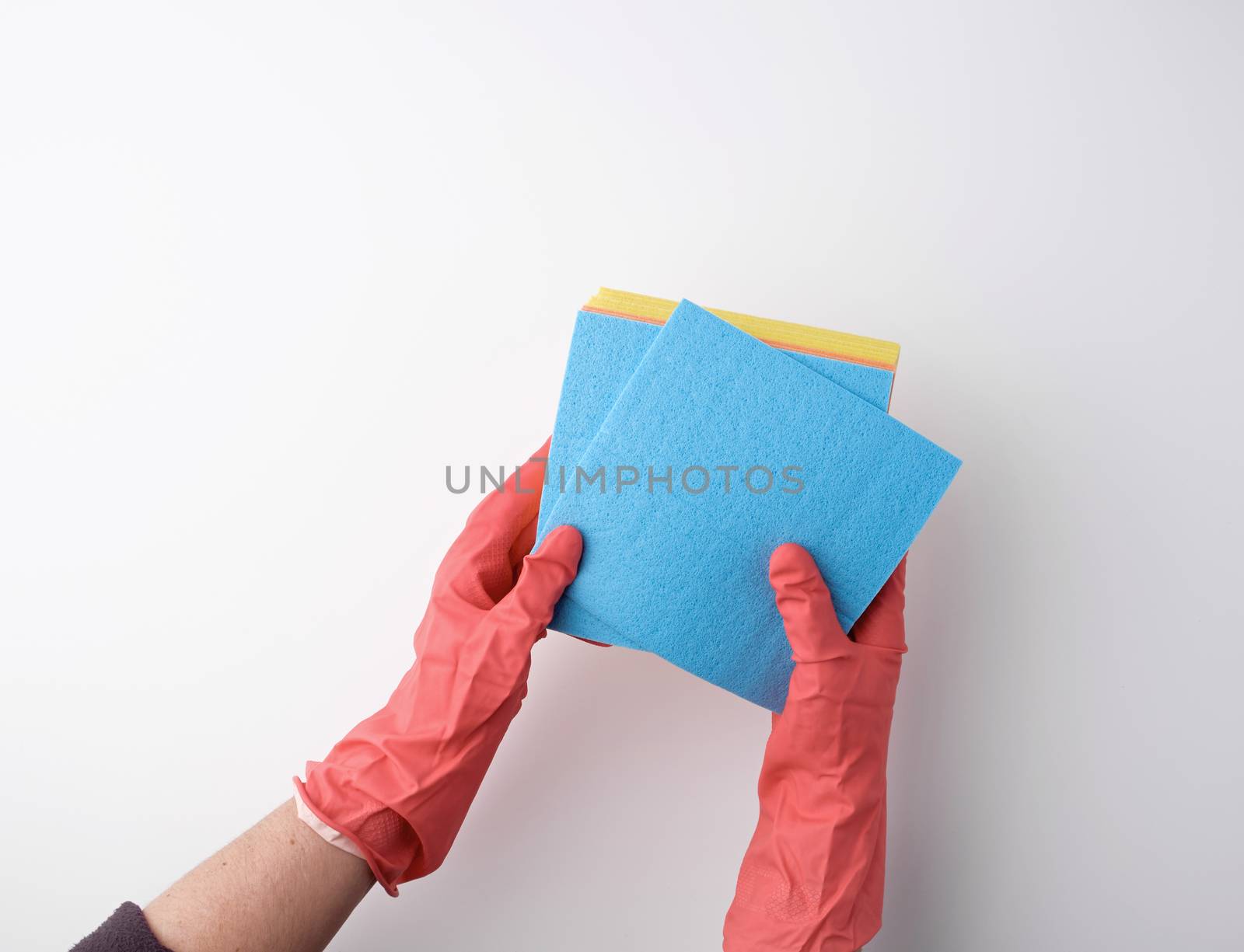 blue square absorbent sponges in their hands wearing red rubber gloves, white background, top view, place for text