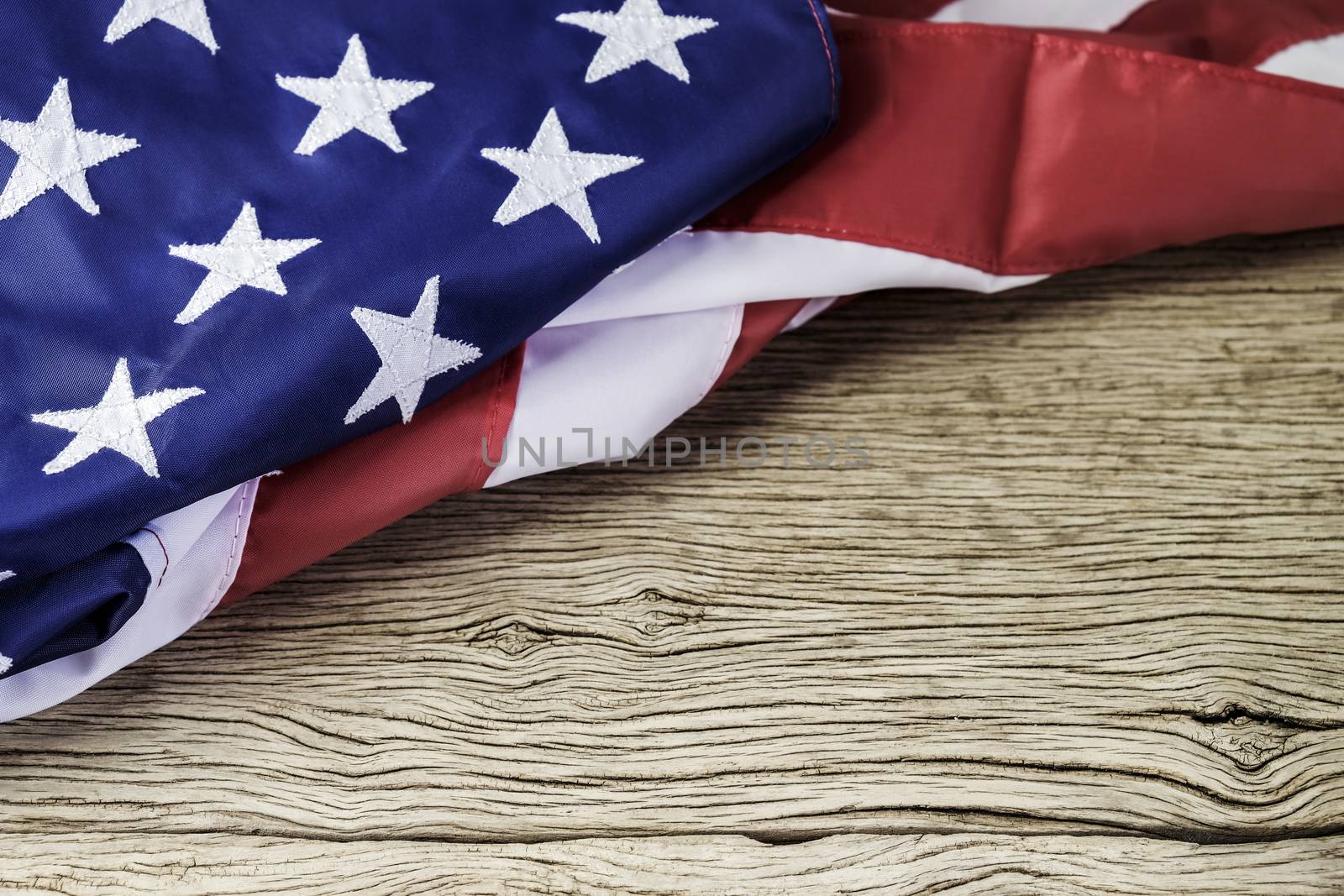 American flag on wood background with copy space