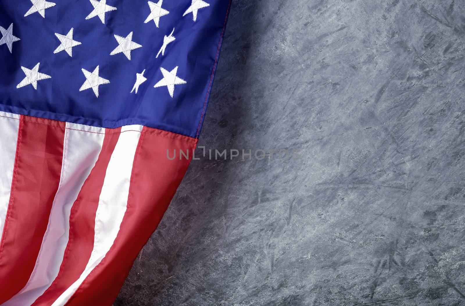 American flag on cement background with copy space