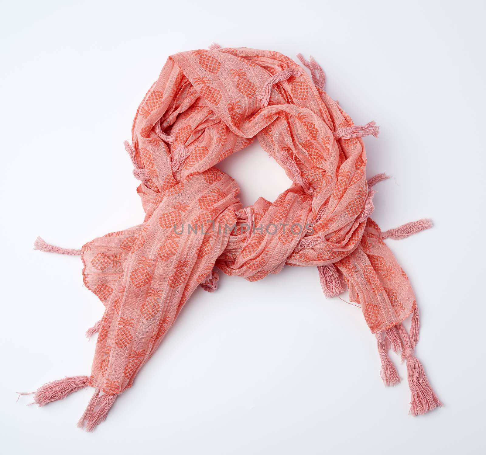 pink female scarf imitates tying around the neck on a white background, top view