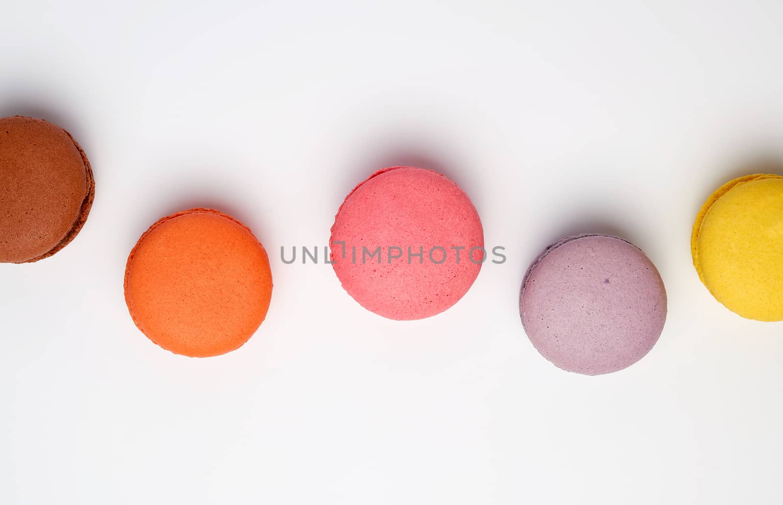 colorful baked macaron almond flour on a white background, flat lay