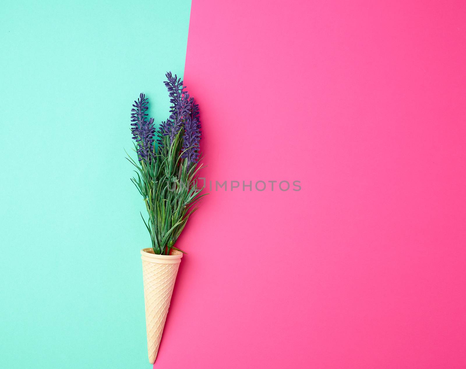 lavender bouquet and red ribbon on a color background, top view, copy space