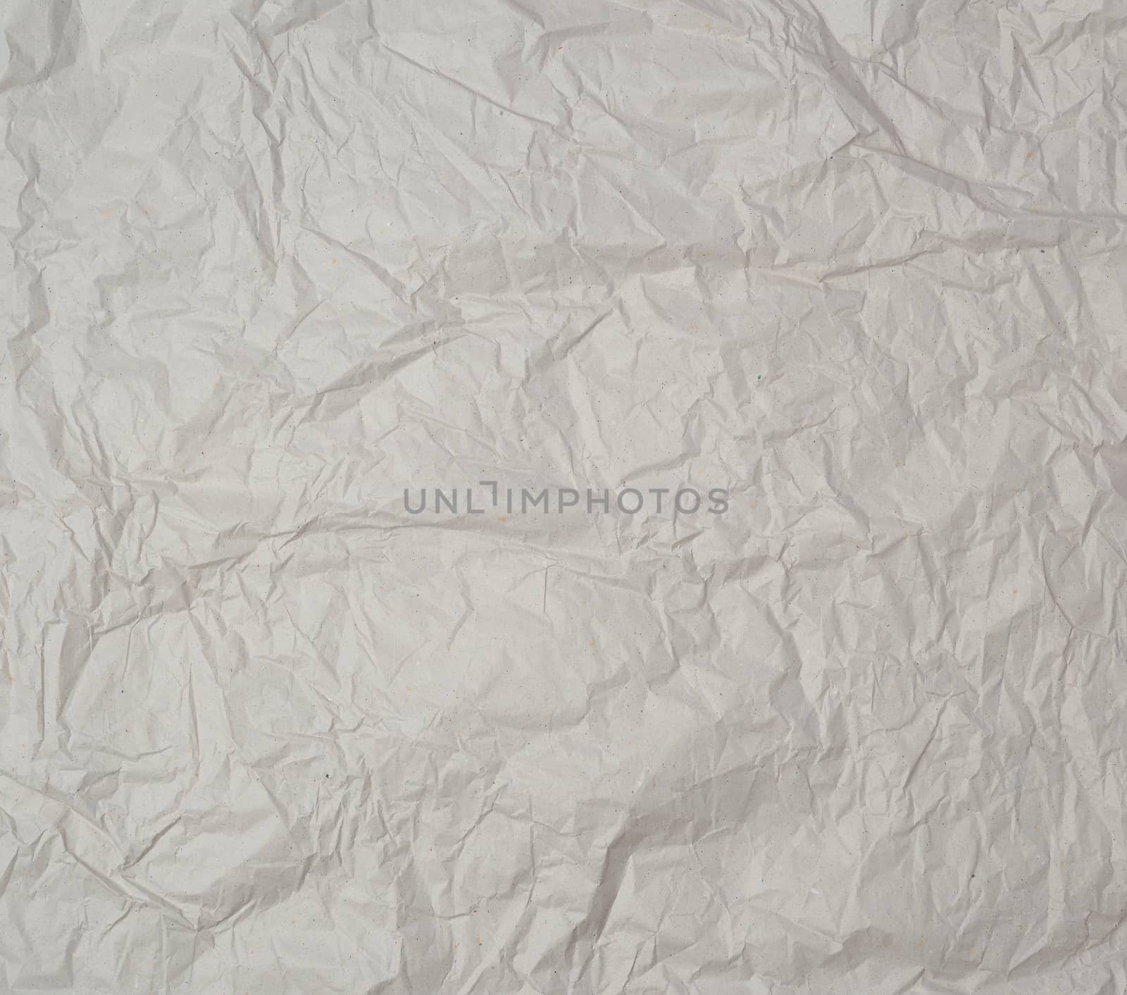 empty gray crumpled sheet of paper, full frame, close up