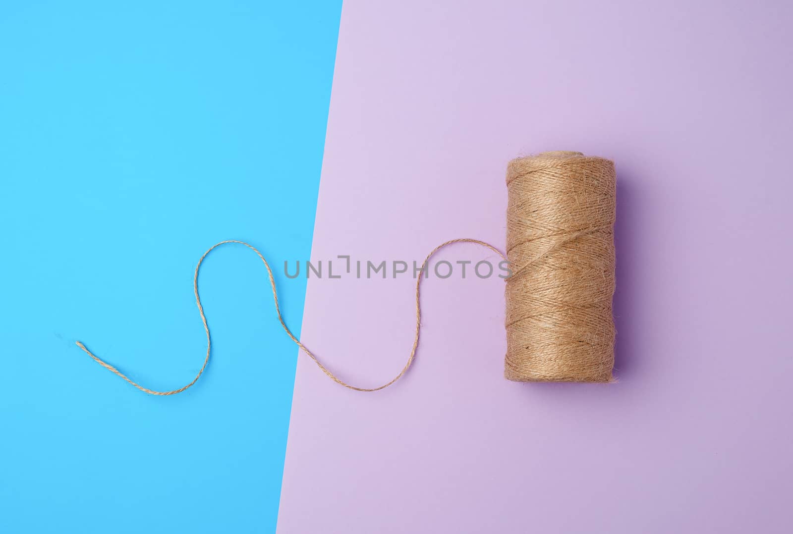 whole coil of twisted brown rope jute tourniquet, eco-friendly packaging