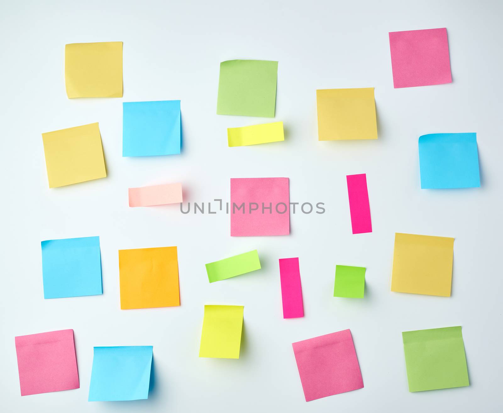 multicolored blank paper stickers of different sizes and shapes on a white background