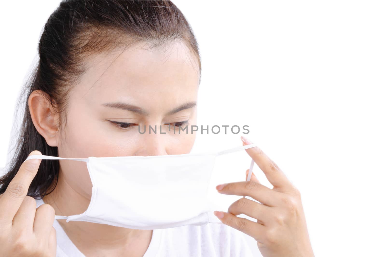 Closeup woman wearing face mask for protect air polution or virus covid 19 , health care and medical concept
