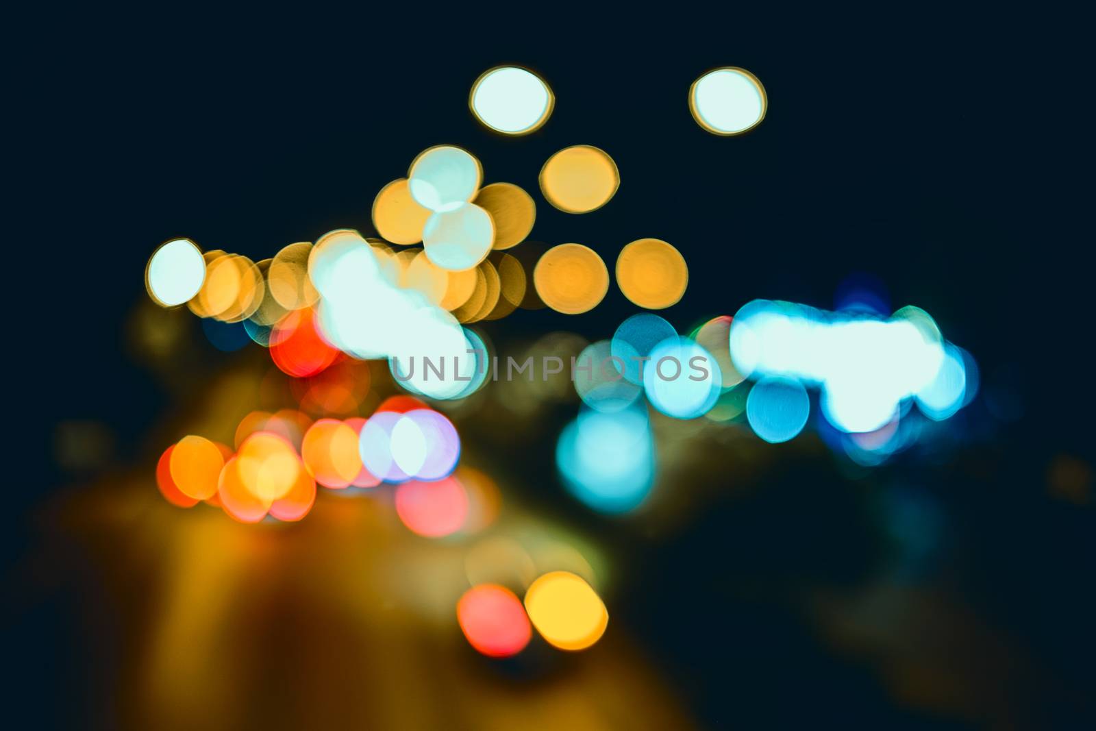 Abstract background, bokeh light on the traffic road at night