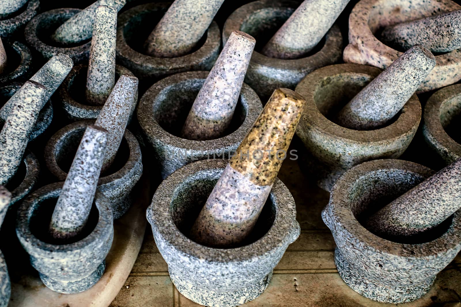 Granite stone mortar and pestle, the famous Thai kitchenware product at Ang Sila, Chonburi, Thailand
