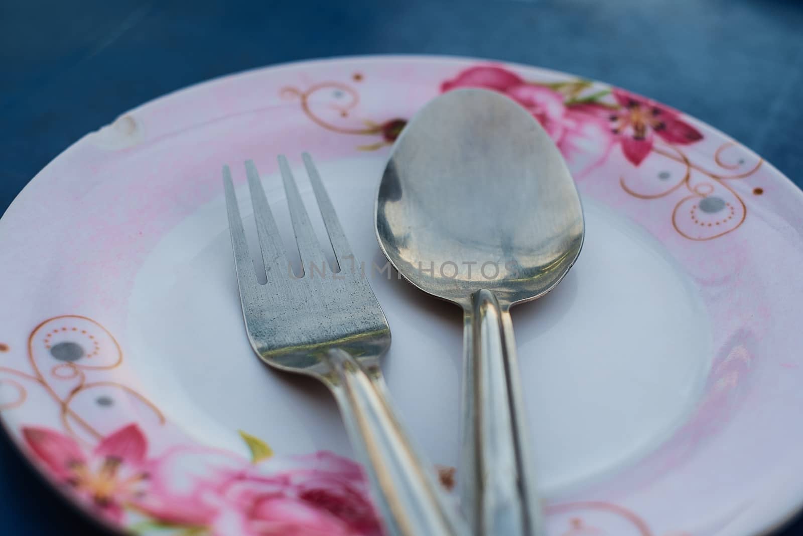 Spoon and fork on plate