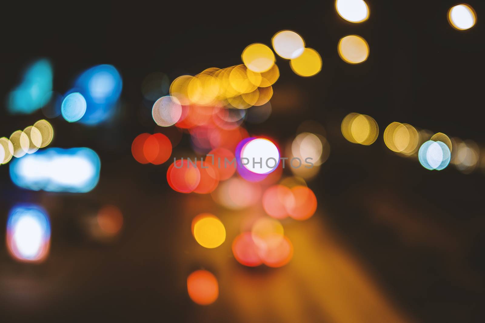 Abstract background, bokeh light on the traffic road at night