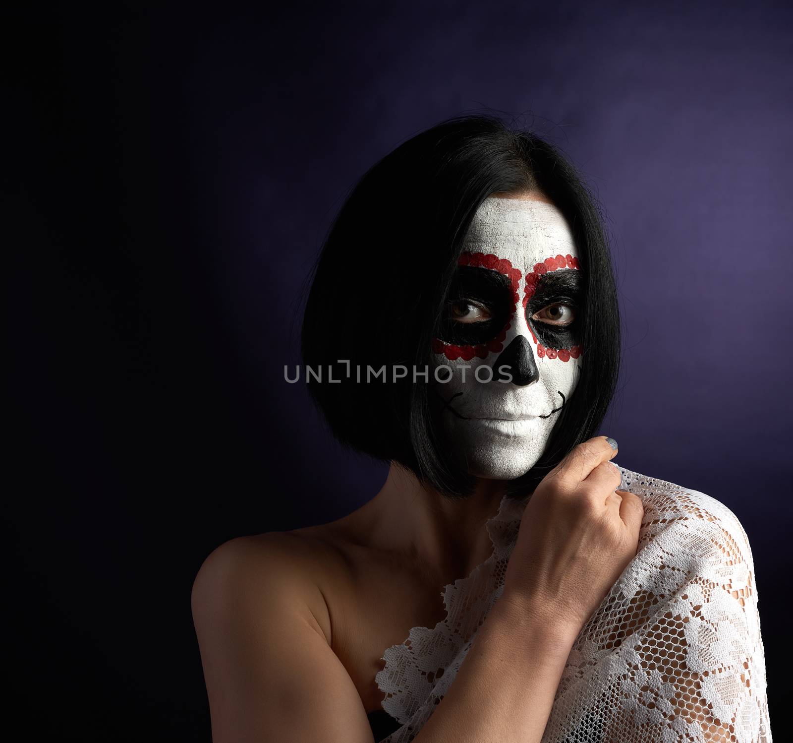 woman with black short hair in white makeup Sugar head to the day of the dead, black background