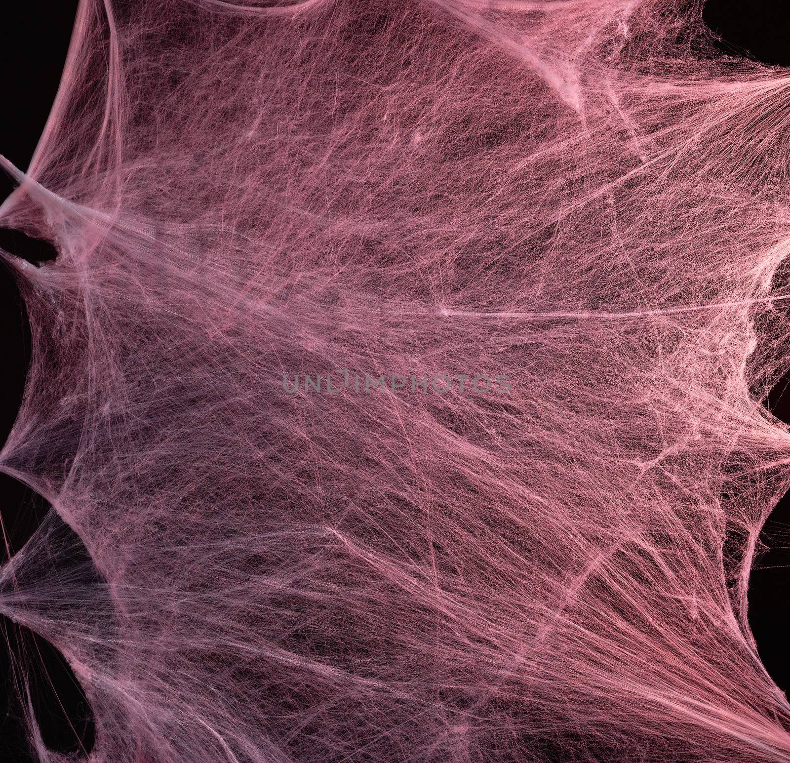 stretched white web with red backlight, background for the holiday Halloween, copy space