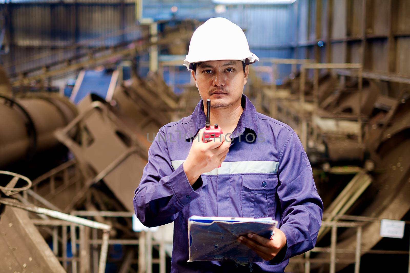 Engineer working in the production line process of granular coal plant