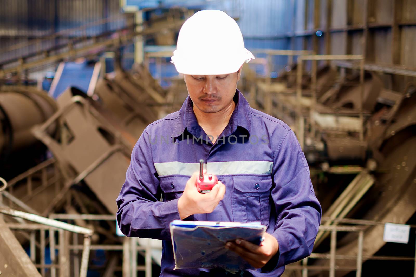 Engineer working in the production line of granular coal process plant