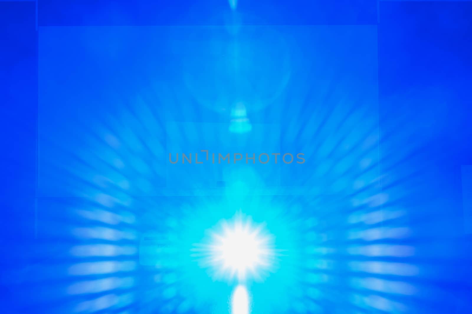 Blue light from projector in the dark meeting room