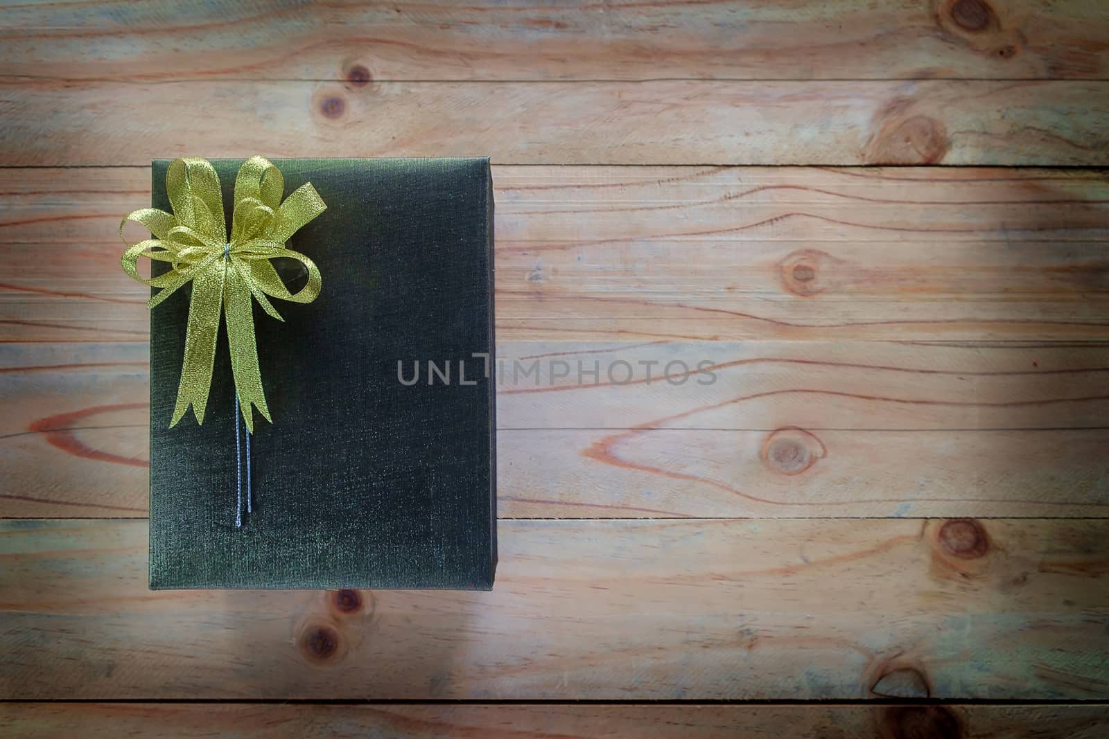 Gift box on wooden table