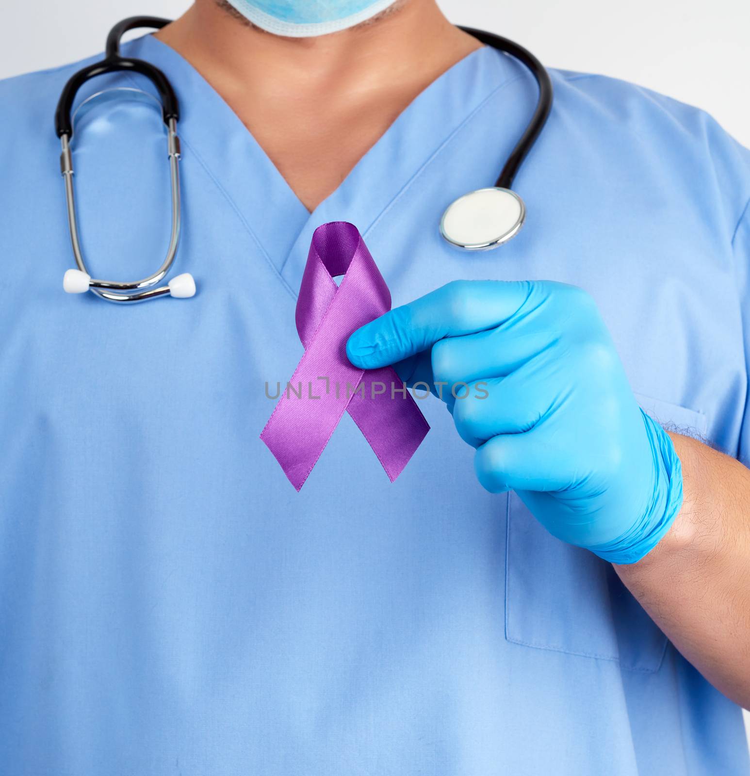 doctor in blue uniform and latex gloves holds a purple ribbon as a symbol of early research and disease control, Alzheimer's disease, cystic fibrosis, lupus, pancreatic cancer, sarcoidosis