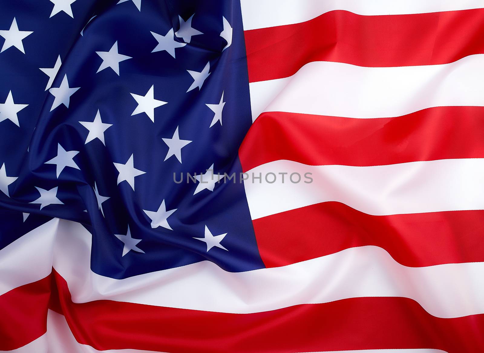 national textile flag of United States of America, surface in waves. Independence Day Background