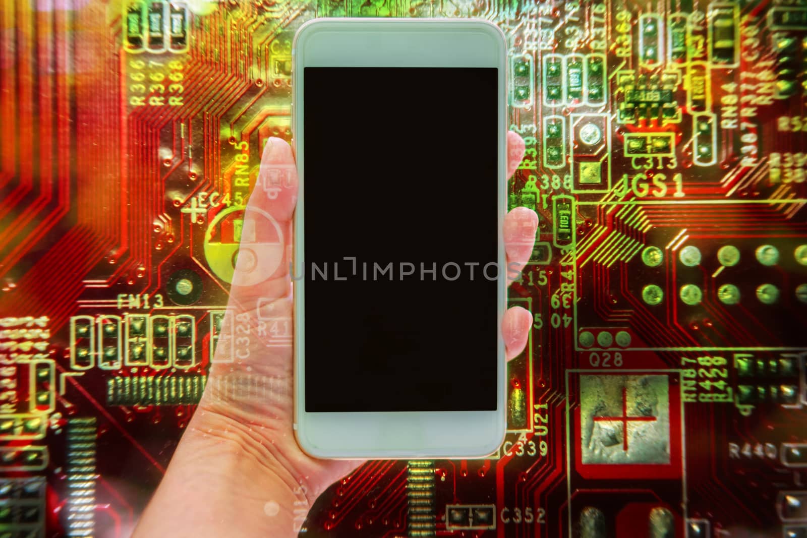Double exposure of hand holding mobile smartphone and electronic circuit board, communication technology concept