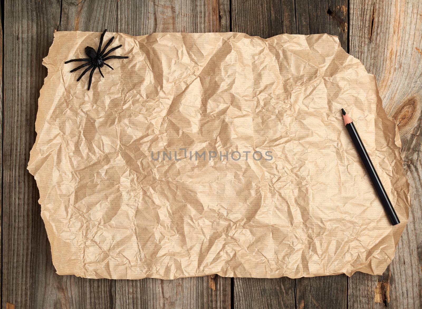brown paper on a wooden surface from old boards, copy space