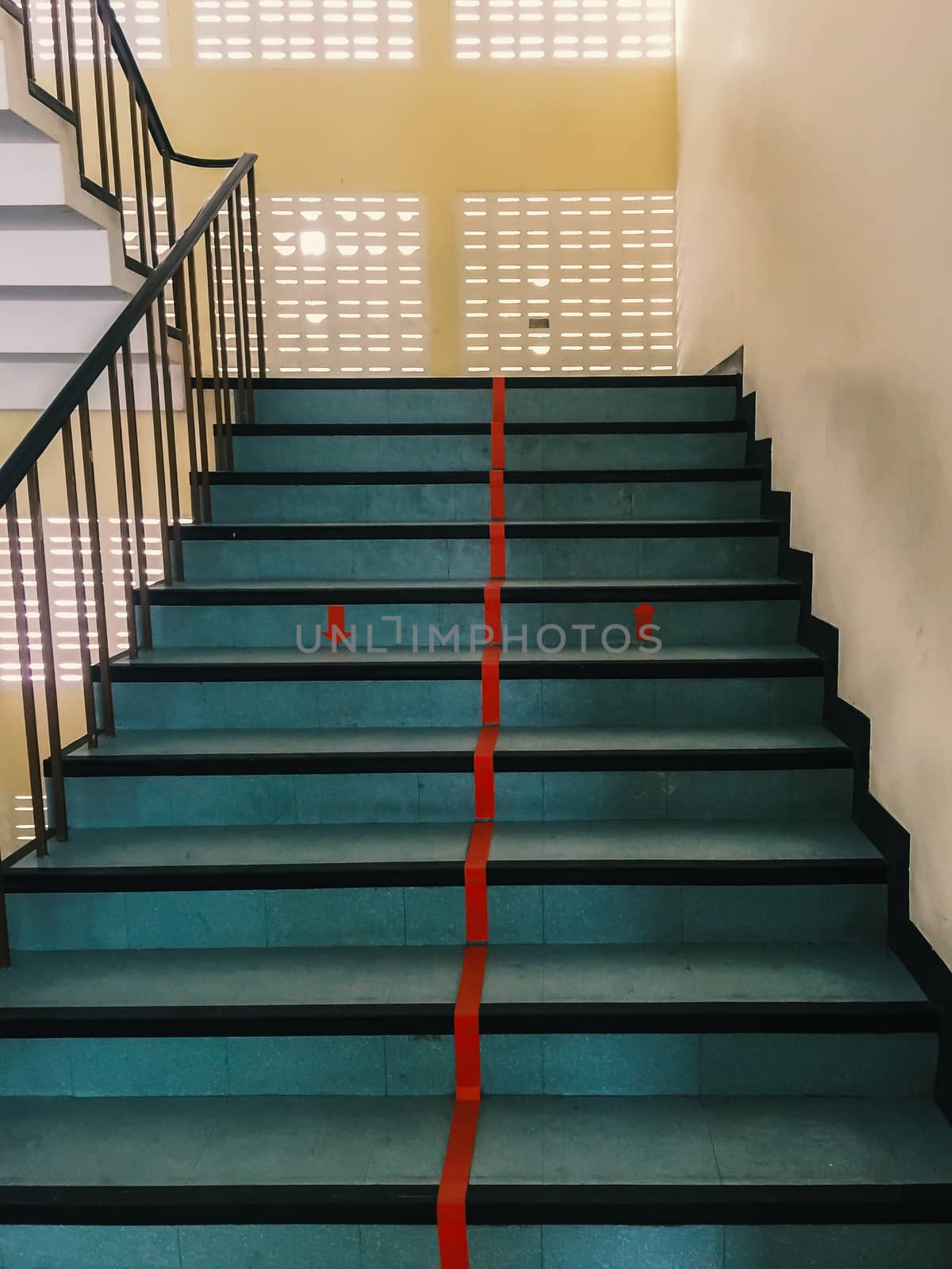 Staircase which the red line to divide into two lanes : up and down (mobile photography)