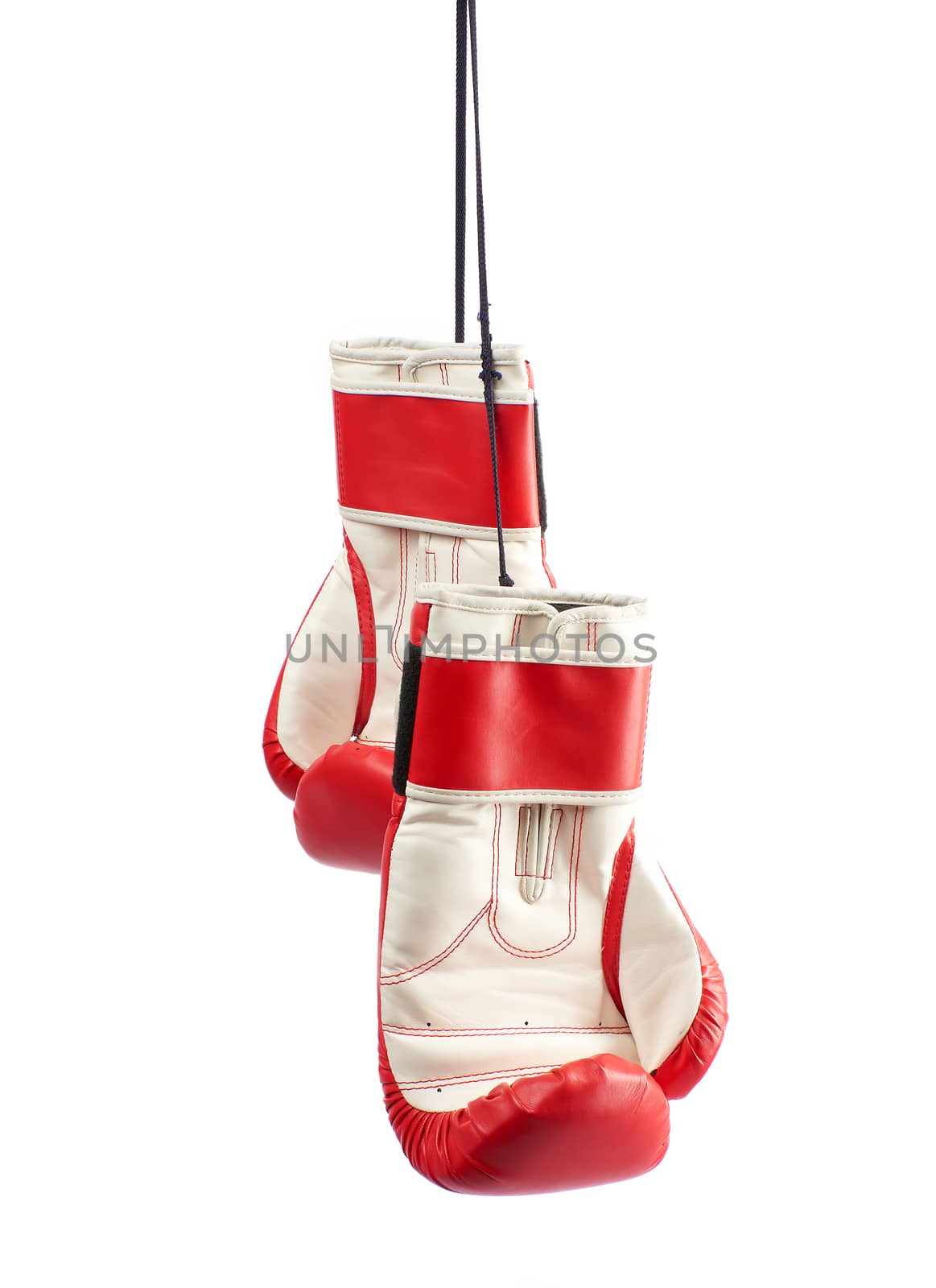 pair of red leather boxing gloves hanging on a black rope by ndanko