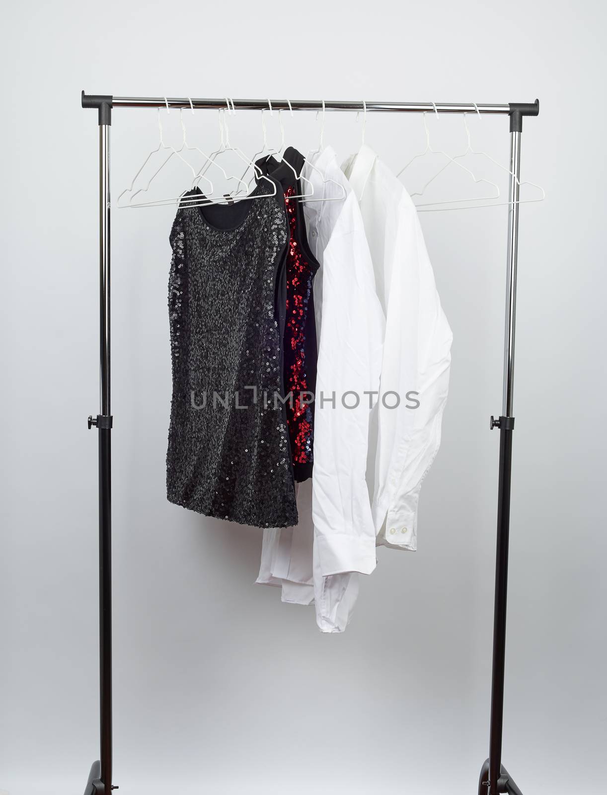 black women's blouse with red sequins, white men's shirts hang o by ndanko