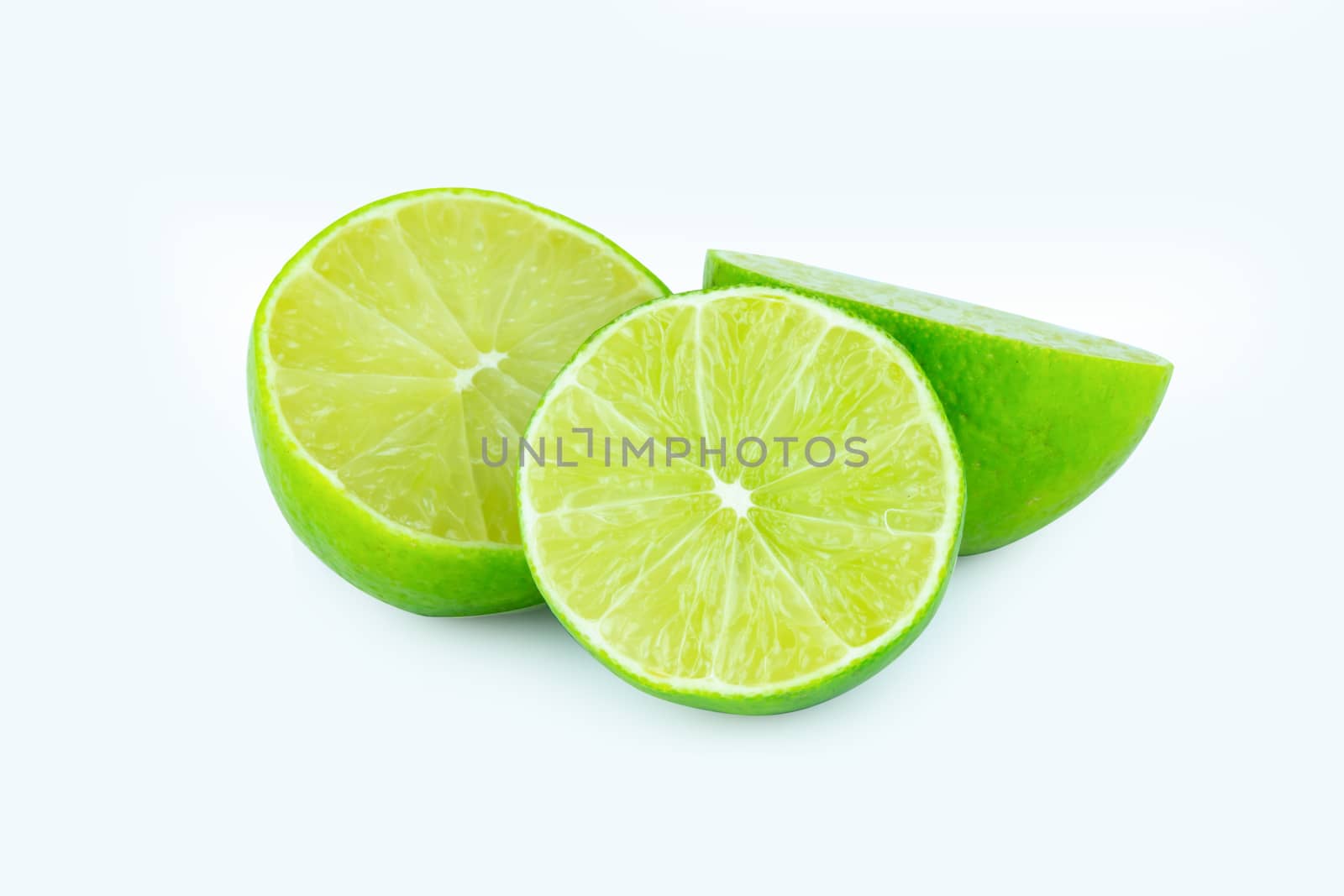 Lime with slices half isolated on white background. Green citrus fruit. with clipping path