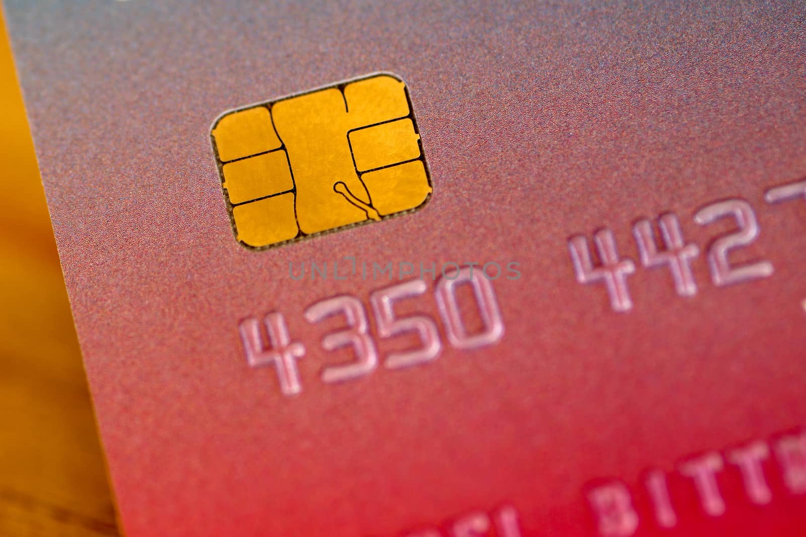 Close-up of credit or debit payment card with chip. Smart card macro, card chip