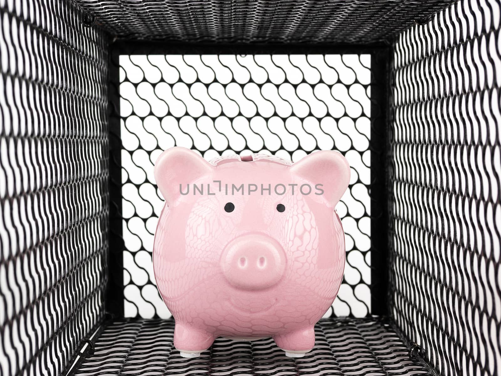 Piggy bank in mouse trap on white background