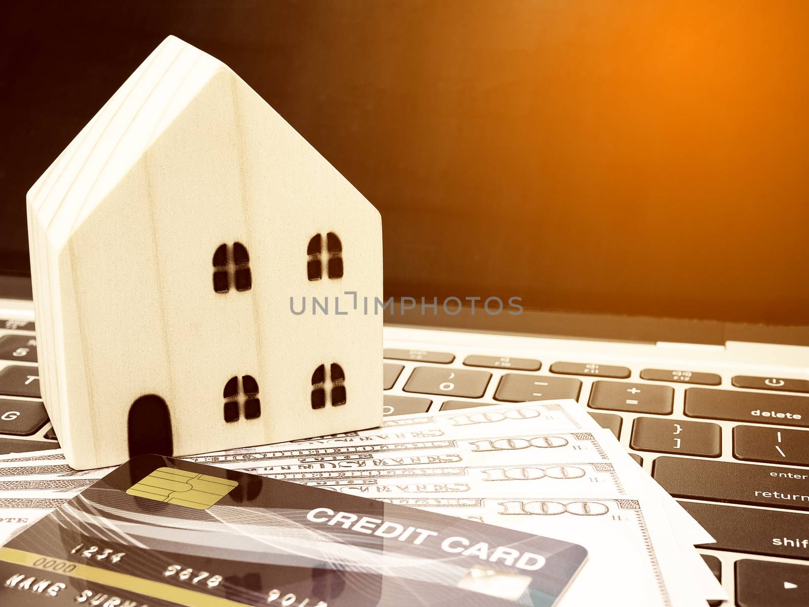 Small wooden houses with modern design and Credit card for home loans concept.