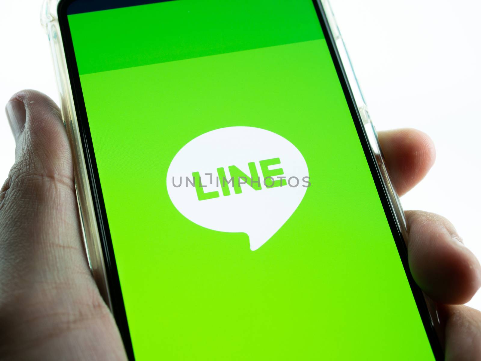 BANGKOK ,THAILAND - MARCH 21, 2020 : LINE application Logo on Huawei P30 Smartphone Display, Is a Most famous Messenger.
