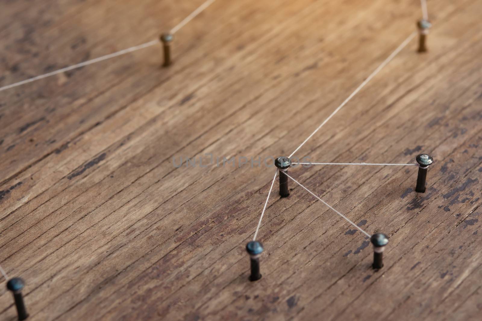 Connecting networks concept - network connected with yarn white on Plank wood with copy space. Simulator connection social media, internet, people communication, Linking entities
