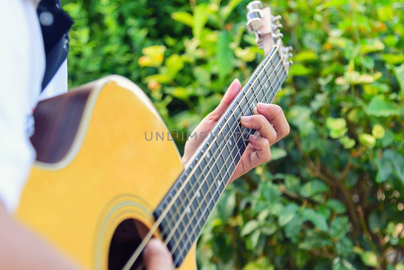 playing guitar in the park