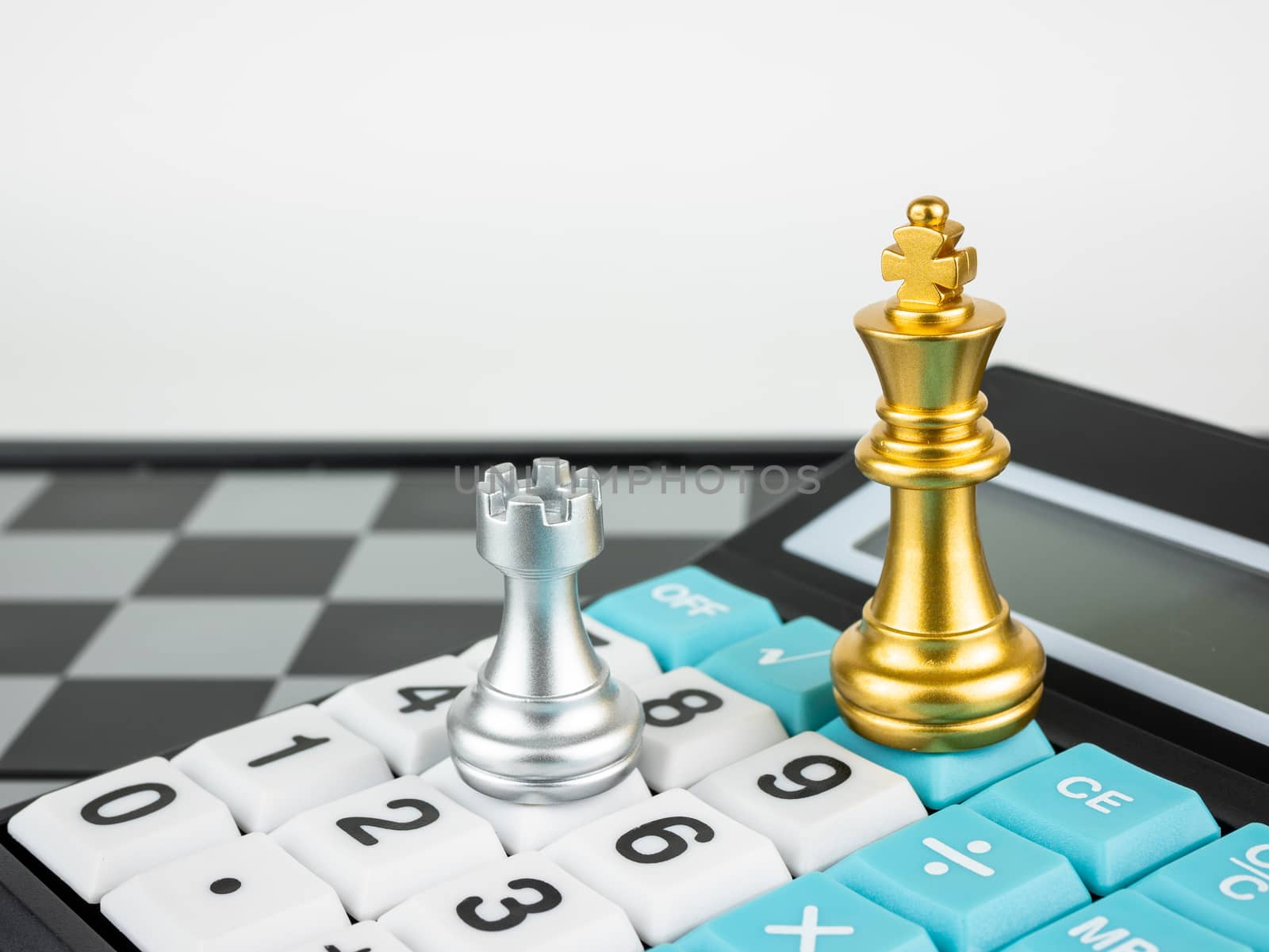 Financial games concept, Game of chess with calculator, selective focus.