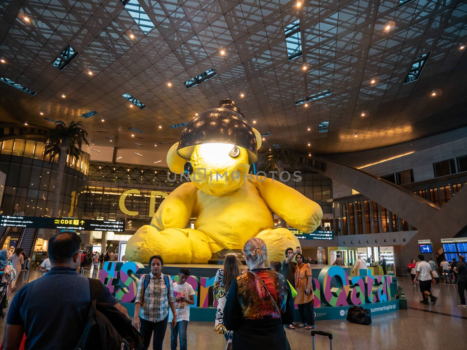 DOHA, QATAR - MAY. 31, 2019: Yellow Lamp bear at Hamad International Airport.
